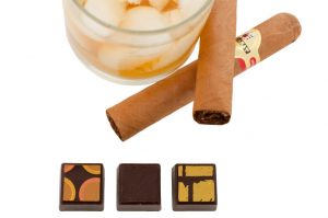 Delysia Chocolatier Gentlemans Collection with scotch, dark chocolate, and cigar